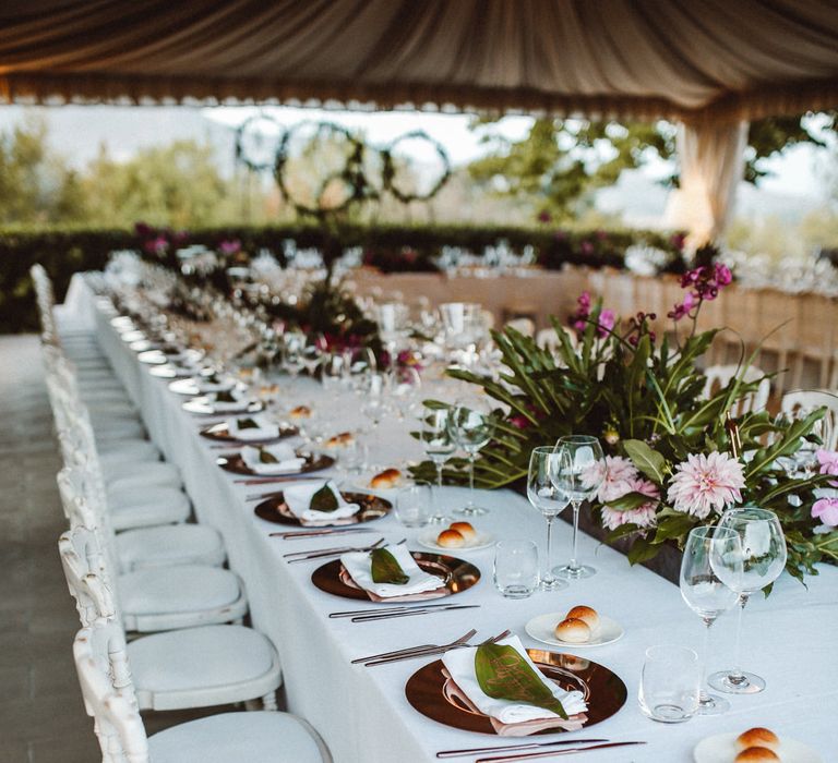 Elegant Tablescape | Tropical Green & Fuchsia Pink Outdoor Wedding at Castellina de Miremont, Italy Planned & Styled by Come le Ciliegie Wedding & Events | Images by Effeanfotografie | Film by Headshot Weddings