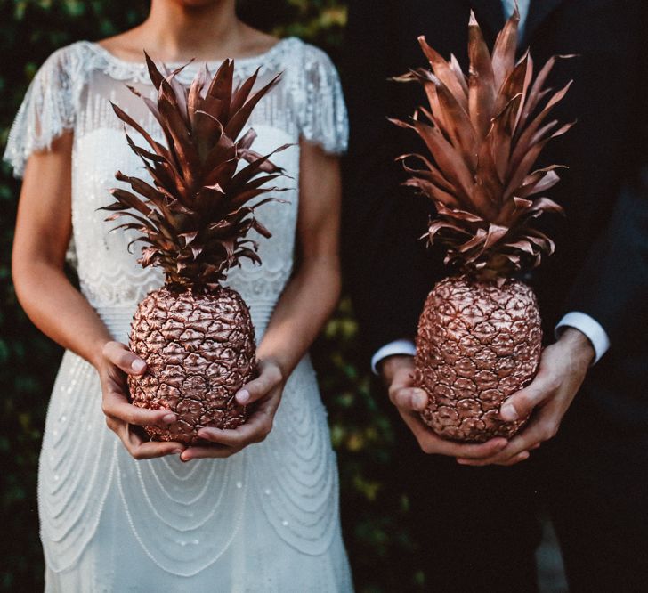 Gold Spray Painted Pineapples | Bride in Jenny Packham Dolly Bridal Gown | Groom in Four Stroke Suit | Tropical Green & Fuchsia Pink Outdoor Wedding at Castellina de Miremont, Italy Planned & Styled by Come le Ciliegie Wedding & Events | Images by Effeanfotografie | Film by Headshot Weddings