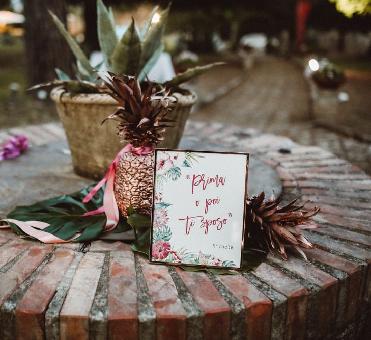 Spray Painted Copper Pineapple & Stationery | Tropical Green & Fuchsia Pink Outdoor Wedding at Castellina de Miremont, Italy Planned & Styled by Come le Ciliegie Wedding & Events | Images by Effeanfotografie | Film by Headshot Weddings