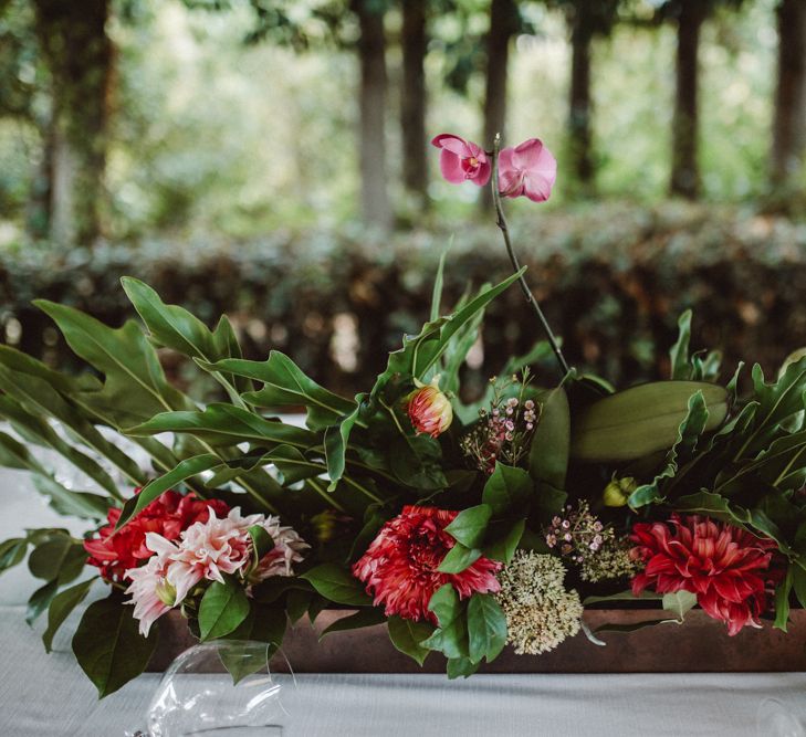 Floral Arrangement | Tropical Green & Fuchsia Pink Outdoor Wedding at Castellina de Miremont, Italy Planned & Styled by Come le Ciliegie Wedding & Events | Images by Effeanfotografie | Film by Headshot Weddings