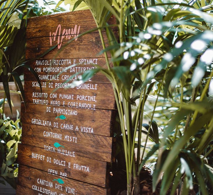 Wooden Menu Board | Tropical Green & Fuchsia Pink Outdoor Wedding at Castellina de Miremont, Italy Planned & Styled by Come le Ciliegie Wedding & Events | Images by Effeanfotografie | Film by Headshot Weddings