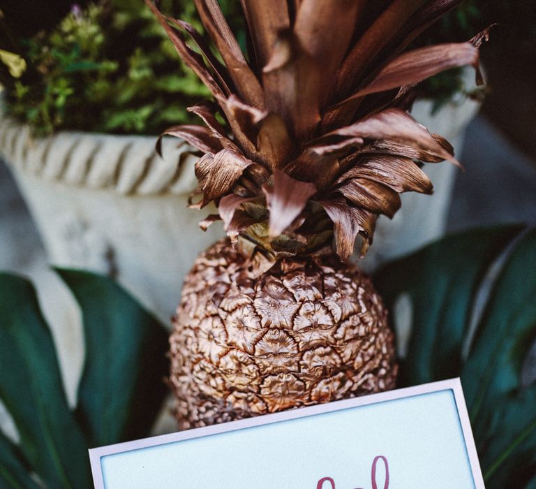 Guest Book Sign & Golden Pineapple | Tropical Green & Fuchsia Pink Outdoor Wedding at Castellina de Miremont, Italy Planned & Styled by Come le Ciliegie Wedding & Events | Images by Effeanfotografie | Film by Headshot Weddings