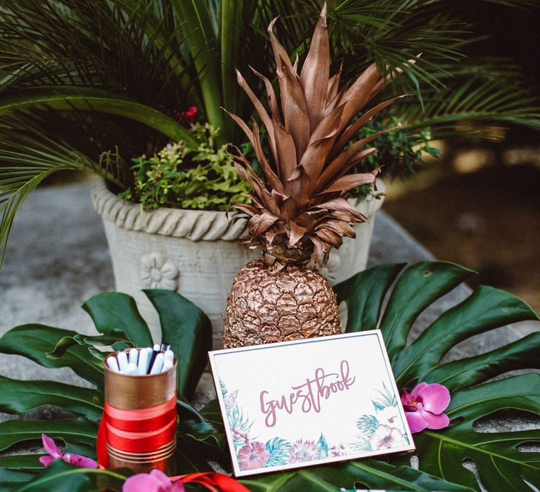 Guest Book Wedding Decor | Tropical Green & Fuchsia Pink Outdoor Wedding at Castellina de Miremont, Italy Planned & Styled by Come le Ciliegie Wedding & Events | Images by Effeanfotografie | Film by Headshot Weddings