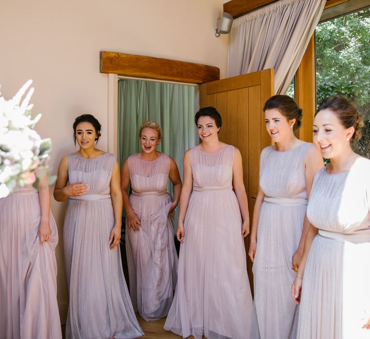 Bridesmaids In Pink & Purple Dresses