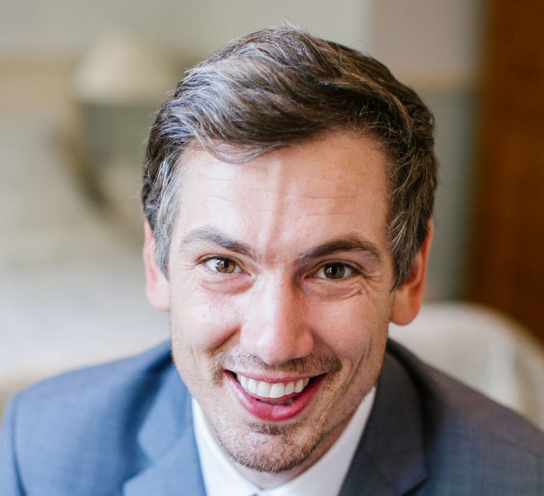 Groom In Pale Grey Suit By Moss