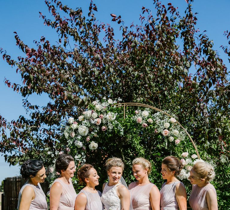 Bride In Sassi Holford With Bridesmaids In Purple & Pink Maxi Dresses From Debenhams