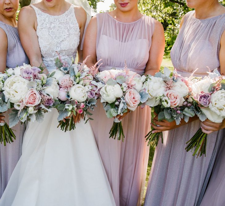 Bride In Sassi Holford With Bridesmaids In Purple & Pink Maxi Dresses From Debenhams