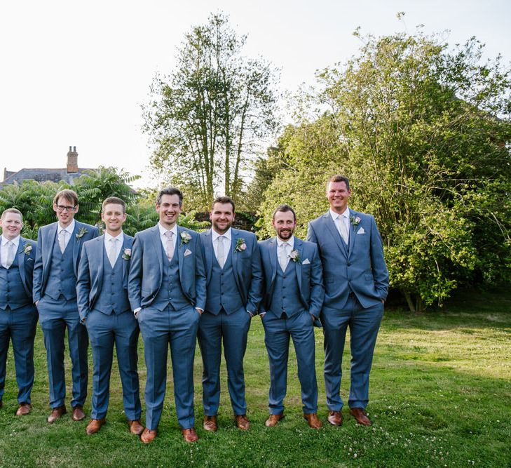 Groom & Groomsmen In Grey Suits Moss Bros