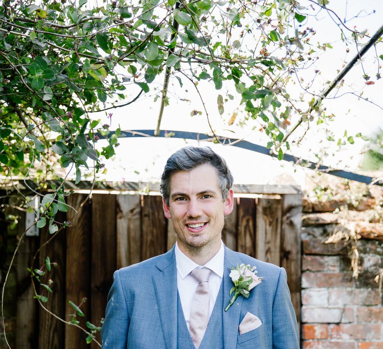 Groom In Light Grey Suit From Moss Bros