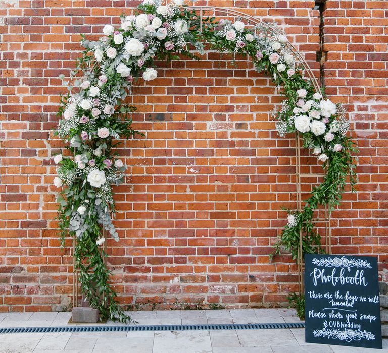 DIY Photobooth At Wedding With Floral Arch