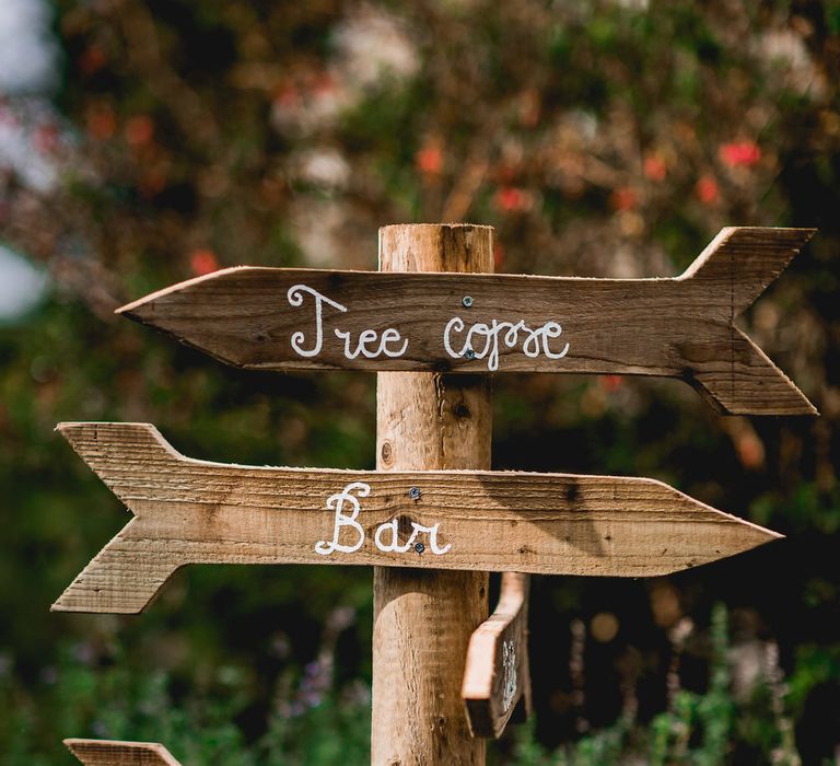 Wooden Signage For Wedding // Embellished Jenny Packham Gown Marquee Wedding At Coombeshead Farm Cornwall The Garden Gate Flower Co Planning Jenny Wren Events Images Barney Walters Photography