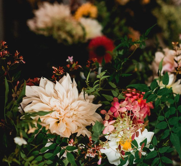 Seasonal Wedding Flowers By The Garden Gate Flower Company // Floral Lined Marquee For Wedding // Embellished Jenny Packham Gown Marquee Wedding At Coombeshead Farm Cornwall The Garden Gate Flower Co Planning Jenny Wren Events Images Barney Walters Photography