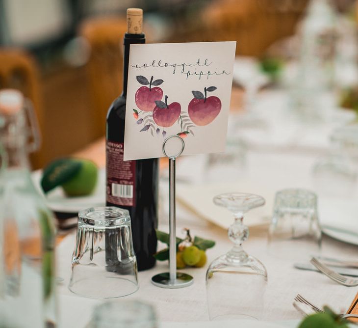 Rustic Wedding Decor For Wooden Trestle Tables / Floral Lined Marquee For Wedding // Embellished Jenny Packham Gown Marquee Wedding At Coombeshead Farm Cornwall The Garden Gate Flower Co Planning Jenny Wren Events Images Barney Walters Photography