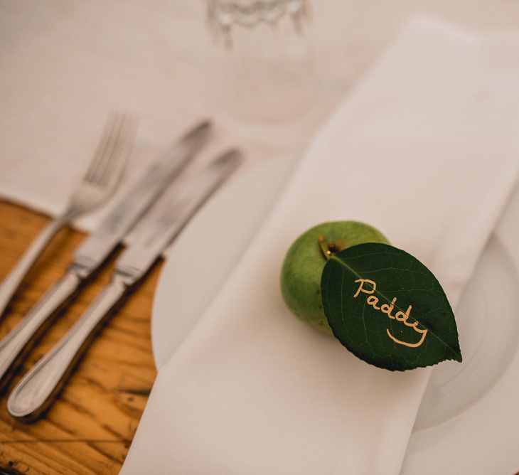 Wedding Place Setting Apple // Floral Lined Marquee For Wedding // Embellished Jenny Packham Gown Marquee Wedding At Coombeshead Farm Cornwall The Garden Gate Flower Co Planning Jenny Wren Events Images Barney Walters Photography