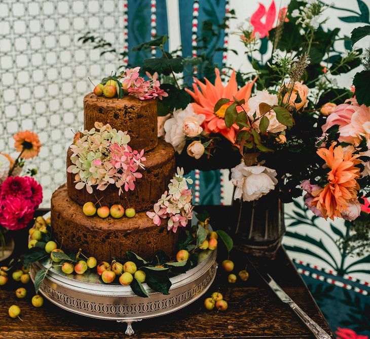 Rustic Wedding Cake With Fresh Fruit And Flowers // Seasonal Wedding Flowers By The Garden Gate Flower Company // Floral Lined Marquee For Wedding // Embellished Jenny Packham Gown Marquee Wedding At Coombeshead Farm Cornwall The Garden Gate Flower Co Planning Jenny Wren Events Images Barney Walters Photography