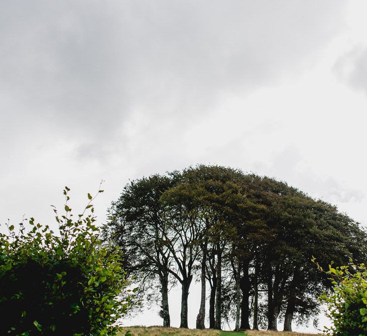 Tree Copse Wedding Ceremony // Farm Wedding Venue Cornwall // Embellished Jenny Packham Gown Marquee Wedding At Coombeshead Farm Cornwall The Garden Gate Flower Co Planning Jenny Wren Events Images Barney Walters Photography