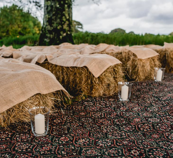 Tree Copse Wedding Ceremony With Hay Bale Seating // Farm Wedding Venue Cornwall // Embellished Jenny Packham Gown Marquee Wedding At Coombeshead Farm Cornwall The Garden Gate Flower Co Planning Jenny Wren Events Images Barney Walters Photography