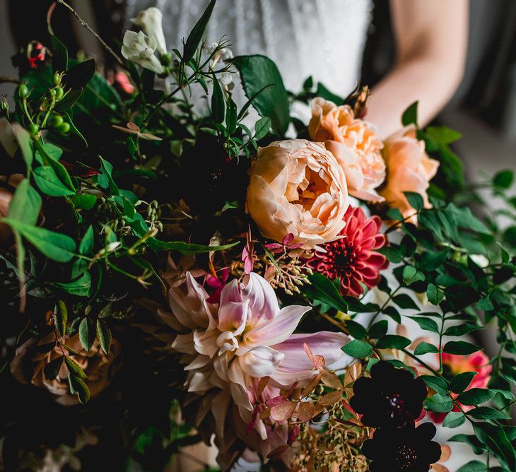 Oversized Seasonal Wedding Bouquet By The Garden Gate Flower Company // Embellished Jenny Packham Gown Marquee Wedding At Coombeshead Farm Cornwall The Garden Gate Flower Co Planning Jenny Wren Events Images Barney Walters Photography