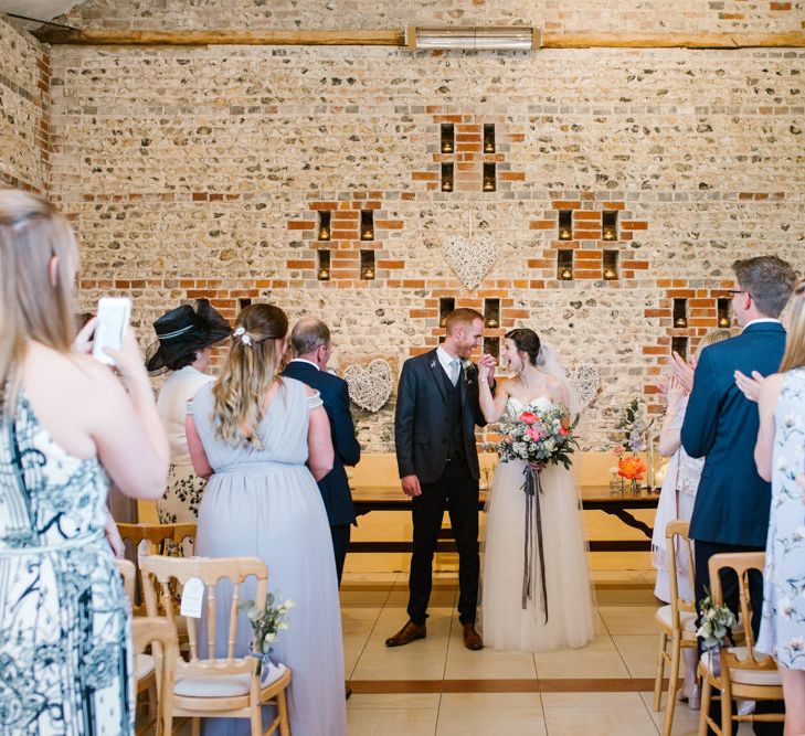 Wedding Ceremony | Bride in Sarah Seven Gown | Groom in Ted Baker & Next | DIY Wedding at Upwaltham Barns with Bright Flowers | Danielle Victoria Photography