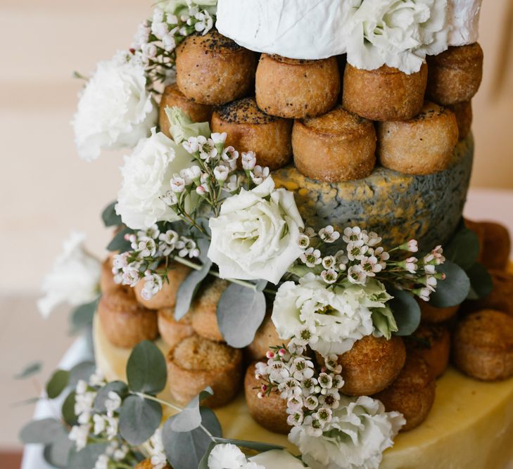 Pork Pies Wedding Cake on Rustic Tree Stump Cake Stand | DIY Wedding at Upwaltham Barns with Bright Flowers | Danielle Victoria Photography