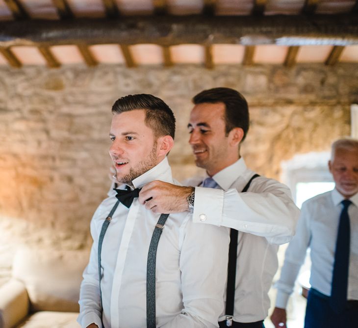 Groom in Tiger of Sweden Wedding Suit & Hugo Boss Bow Tie