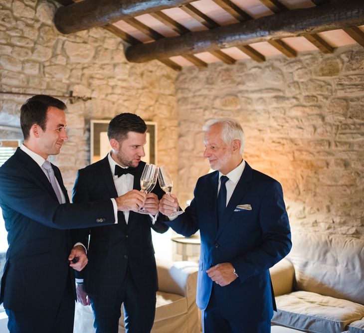 Groom in Tiger of Sweden Wedding Suit & Hugo Boss Bow Tie