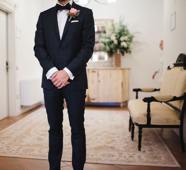 Groom in Tiger of Sweden Wedding Suit & Hugo Boss Bow Tie