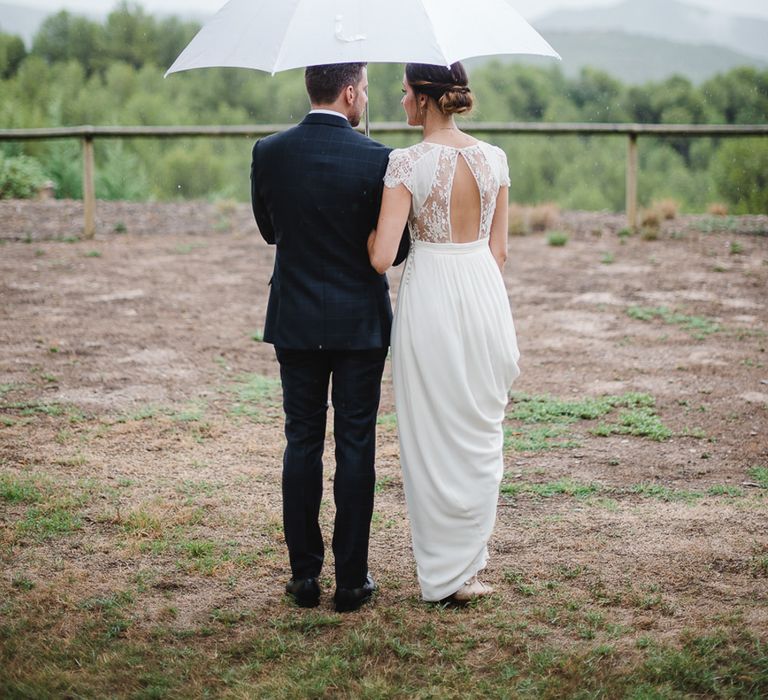 Bride & Groom under an Umbrella