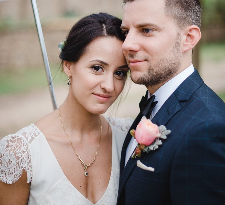 Bride & Groom under an Umbrella