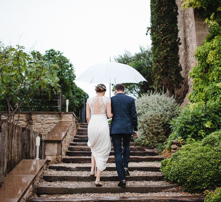 Bride & Groom under an Umbrella