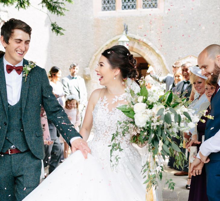 Confetti Moment | Pronovias Taciana Bridal Gown | Groom in Tweed Suit | Greenery & White Marquee Wedding at The Villa, Levens with Copper Details | Bowtie and Belle Photography