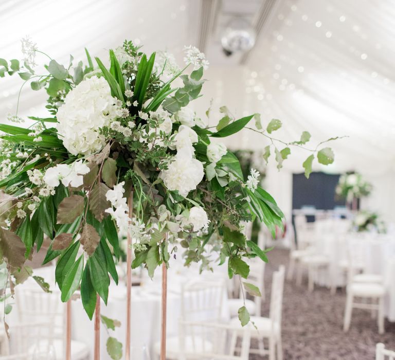 Tall Floral Centrepiece on Copper Plinth | Greenery & White Marquee Wedding at The Villa, Levens with Copper Details | Bowtie and Belle Photography