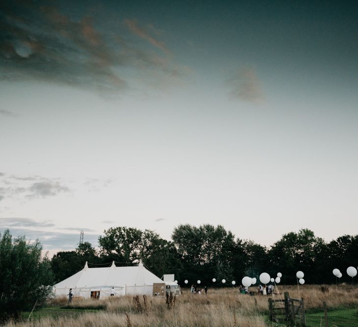 Marquee Wedding | Trestle Tables | Wild Flowers in Jars | Balloons | Hanging Greenery Installations | Andrew Brannan Photography