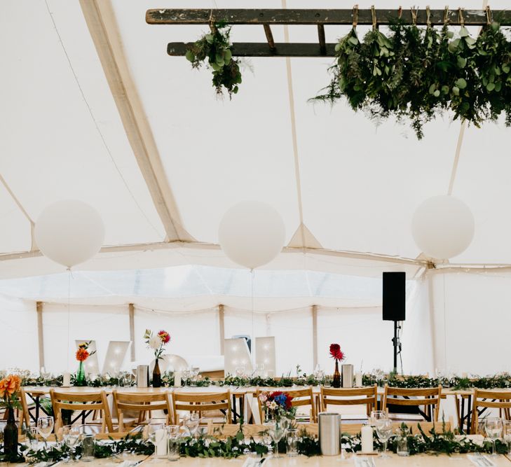 Marquee Wedding | Trestle Tables | Wild Flowers in Jars | Balloons | Hanging Greenery Installations | Andrew Brannan Photography