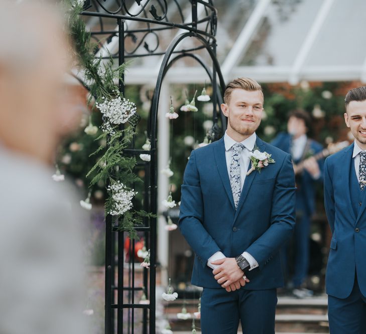 Groom Waiting At End Of Aisle