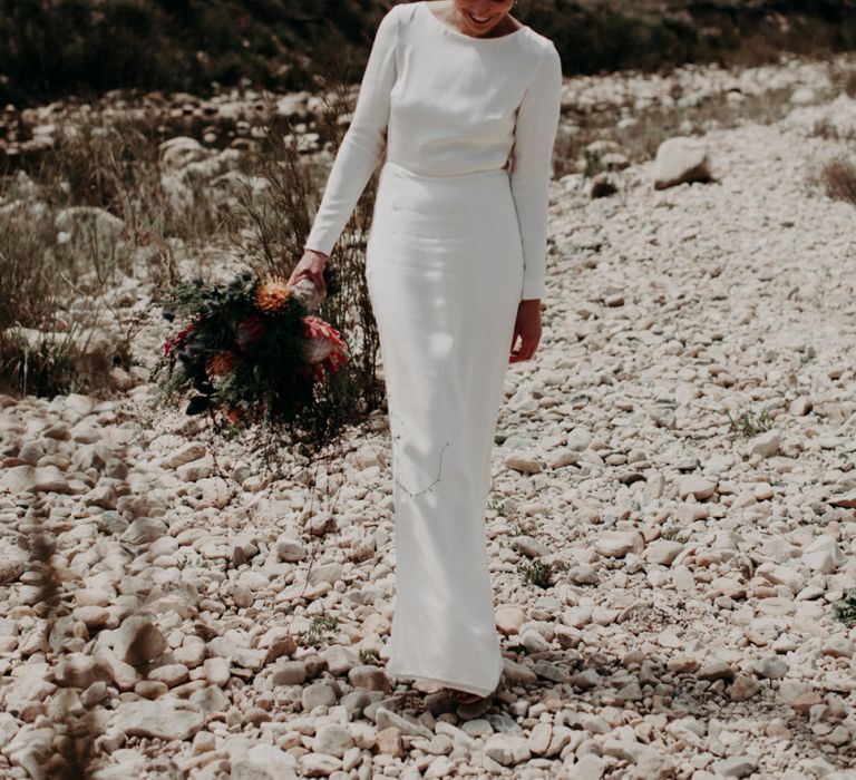 Chic Bride in Fitted Minimalist Wedding Dress with Long Sleeves and Low Back