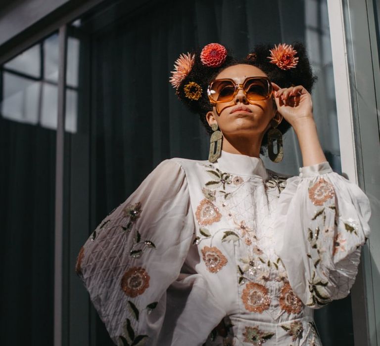 Stylish bride in floral jumpsuit for 70s Disco wedding inspiration