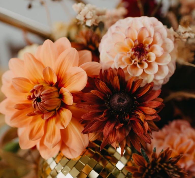 gold glitter ball and dahlias