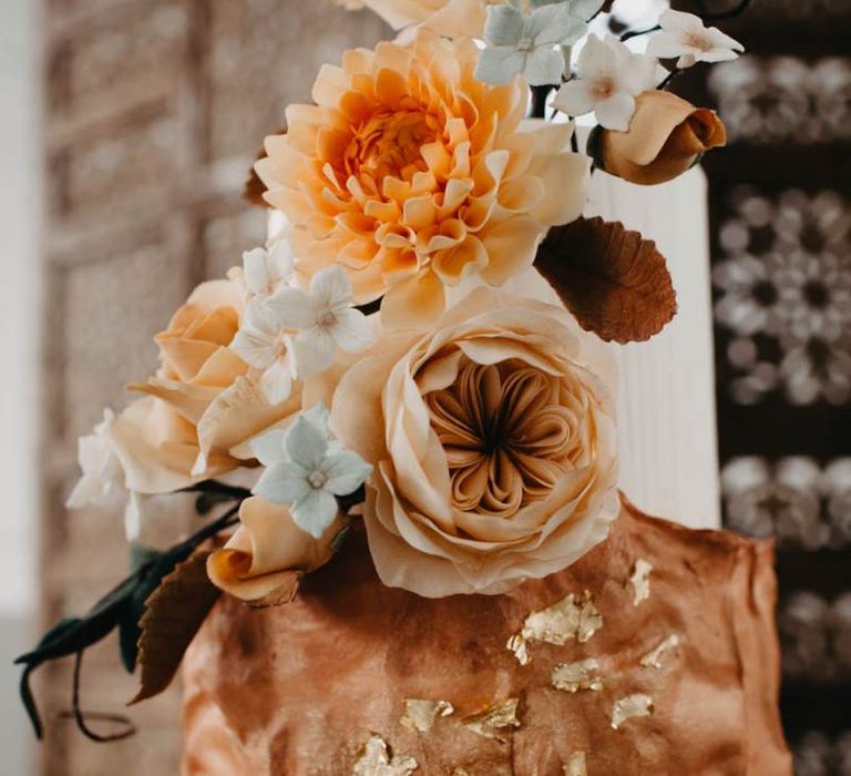 Wedding cake with gold leaf decor