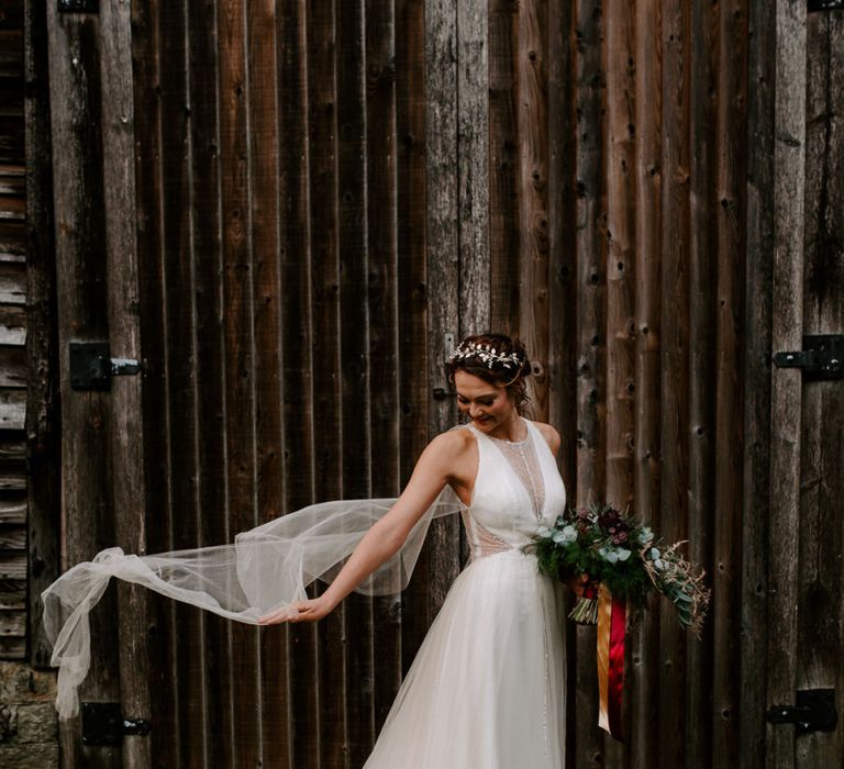 Bride in Halternext Dress with Billowing Veil