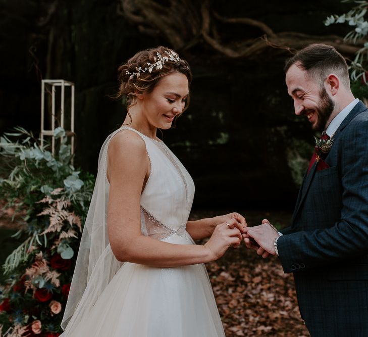 Bride and Groom Exchanging Rings