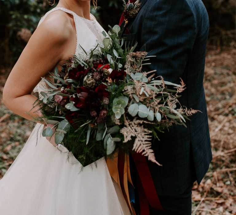 Bride and Groom Portrait with Bride Holding a Wedding Bouquet