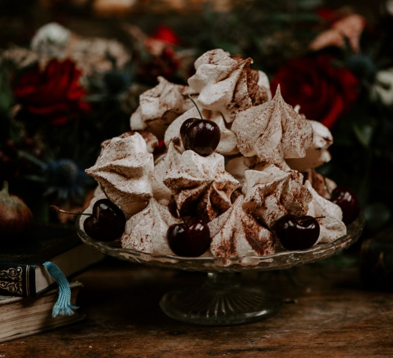 Piled Meringue Kisses and Cherries for Dessert Table