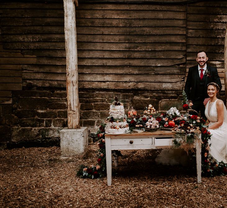 Bride and Groom Enjoying an Intimate Dessert Table