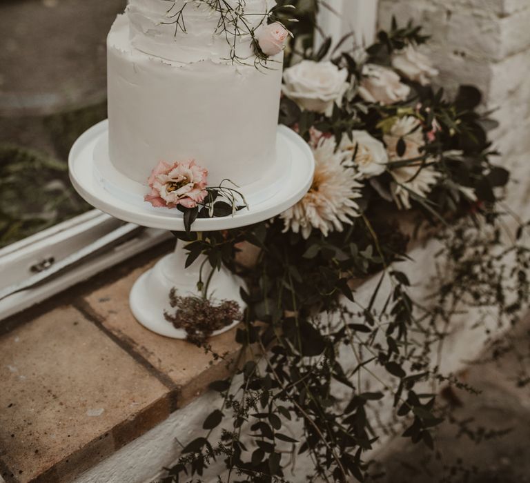 Two Tier Frosted Wedding Cake with Flower Decor | Romantic Pink and Gold Wedding Inspiration in a Modern Summer House at Garthmyl Hall by KnockKnockPenny Studio | Nesta Lloyd Photography