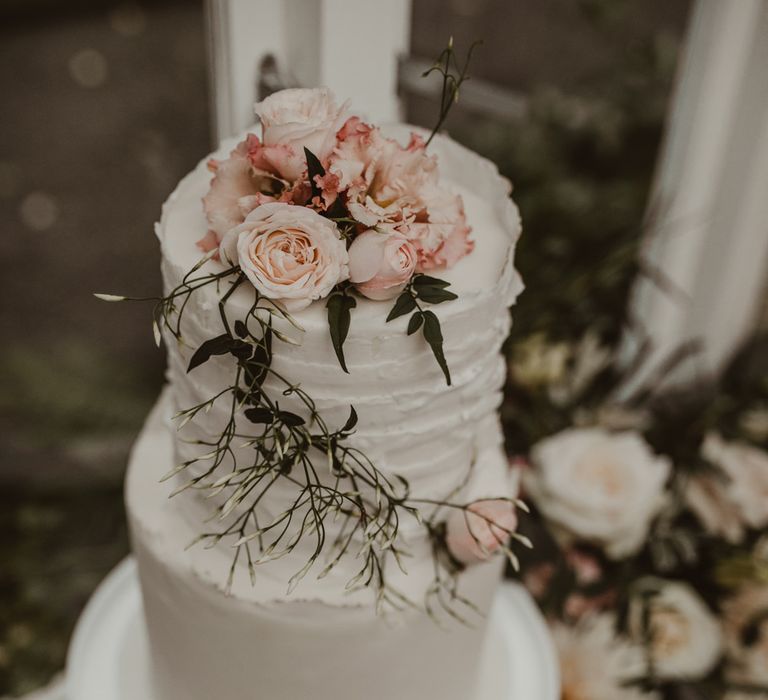 Two Tier Frosted Wedding Cake with Flower Decor | Romantic Pink and Gold Wedding Inspiration in a Modern Summer House at Garthmyl Hall by KnockKnockPenny Studio | Nesta Lloyd Photography