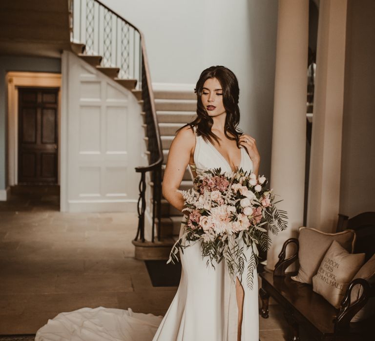 Beautiful Bride in V Neck Strap Wedding Dress with Front Split &amp; Puddle Train | Oversized Pink &amp; Foliage Wedding bouquet | Romantic Pink and Gold Wedding Inspiration in a Modern Summer House at Garthmyl Hall by KnockKnockPenny Studio | Nesta Lloyd Photography