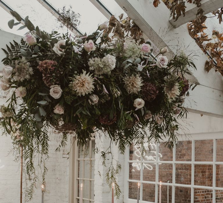 Hanging Floral Installation &amp; Tablescape with Floral Centrepieces &amp; Taper Candles | Romantic Pink and Gold Wedding Inspiration in a Modern Summer House at Garthmyl Hall by KnockKnockPenny Studio | Nesta Lloyd Photography