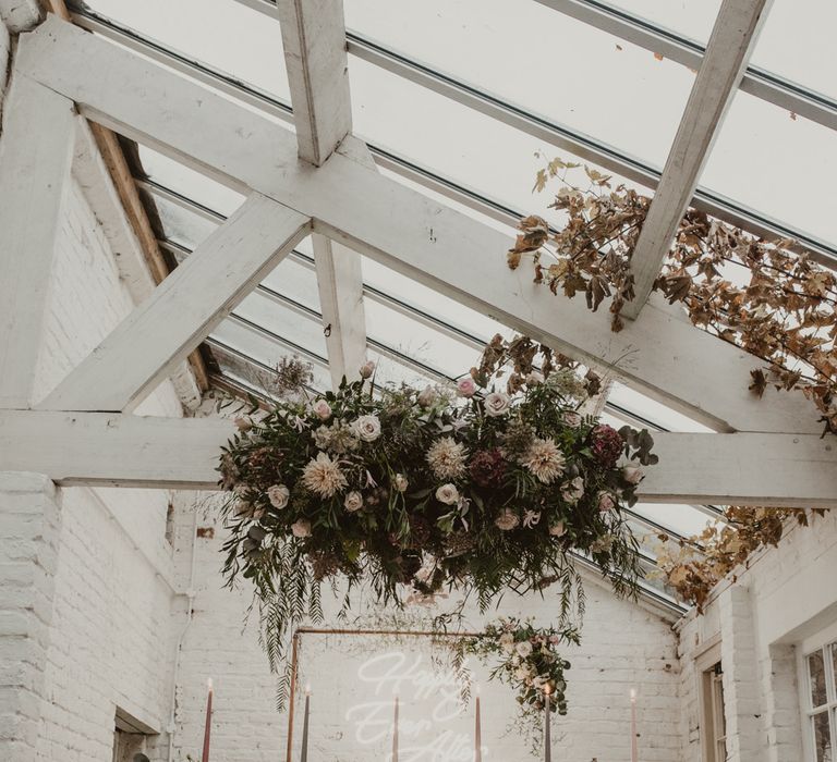 Hanging Floral Installation &amp; Tablescape with Floral Centrepieces &amp; Taper Candles | Romantic Pink and Gold Wedding Inspiration in a Modern Summer House at Garthmyl Hall by KnockKnockPenny Studio | Nesta Lloyd Photography