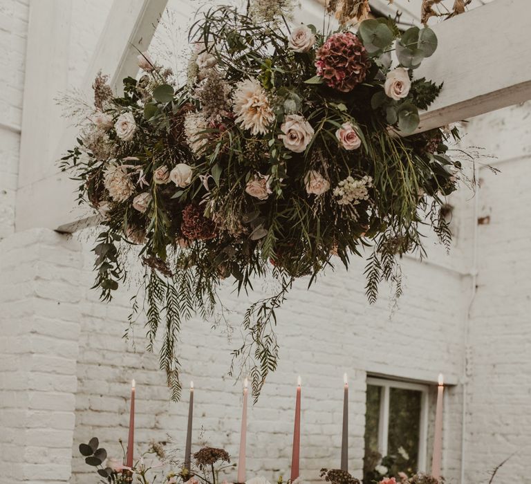 Hanging Floral Installation &amp; Tablescape with Floral Centrepieces &amp; Taper Candles | Romantic Pink and Gold Wedding Inspiration in a Modern Summer House at Garthmyl Hall by KnockKnockPenny Studio | Nesta Lloyd Photography